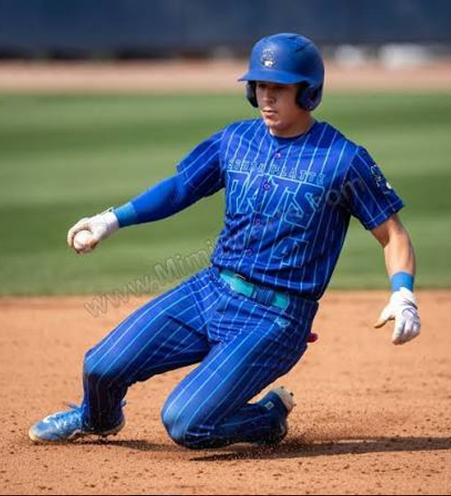 Baseball player wearing a custom baseball jersey and pants